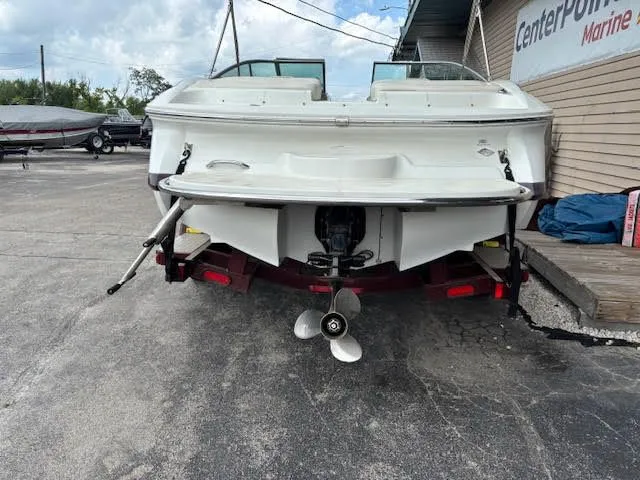 Slide: The Image of Rear view of a 2005 Cobalt 200 boat on a trailer at a marine center. - 6