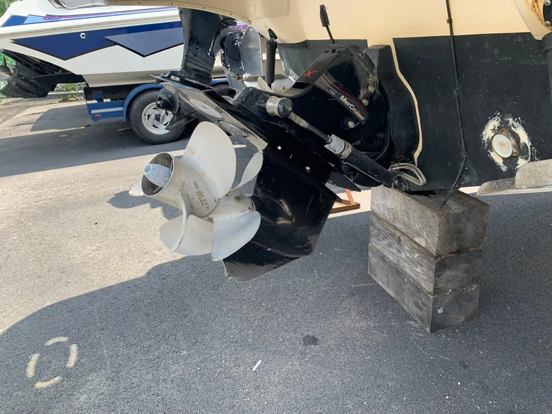 Slide: The Image of Outboard motor of a 2000 Sea Ray 270 Sundancer on wooden blocks. - 21