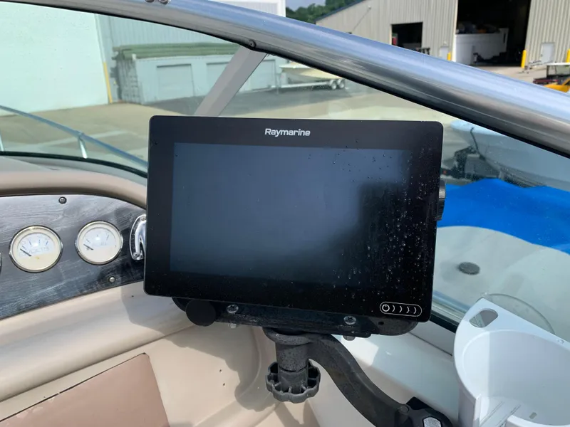 Slide: The Image of Raymarine display on 2000 Sea Ray 270 Sundancer boat dashboard, with gauges visible. - 8