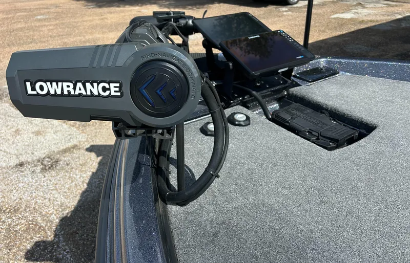 Slide: The Image of 2024 Phoenix 21 XE boat with Lowrance navigation system on deck. - 1