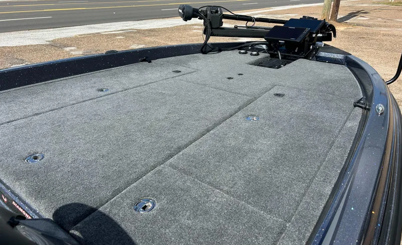 Slide: The Image of 2024 Phoenix 21 XE boat deck with carpeted surface and mounted equipment. - 2