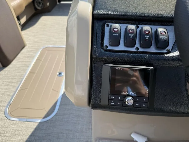 Slide: The Image of Control panel of 2025 Godfrey Monaco 235 SFL boat with JL Audio system. - 10