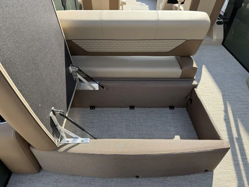 Slide: The Image of 2025 Godfrey Monaco 235 SFL iMPACT boat seat storage compartment, open and spacious. - 23
