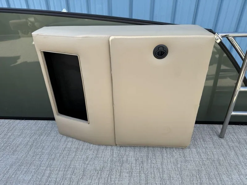 Slide: The Image of 2025 Godfrey Monaco 235 SFL iMPACT boat seat with beige upholstery and storage compartment. - 24