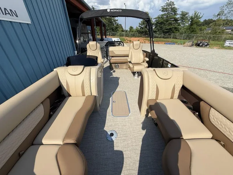 Slide: The Image of 2025 Godfrey Monaco 235 SFL iMPACT pontoon boat with luxurious seating and modern design. - 25