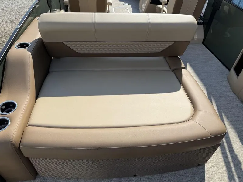Slide: The Image of 2025 Godfrey Monaco 235 SFL iMPACT boat seating with beige upholstery and cup holders. - 27