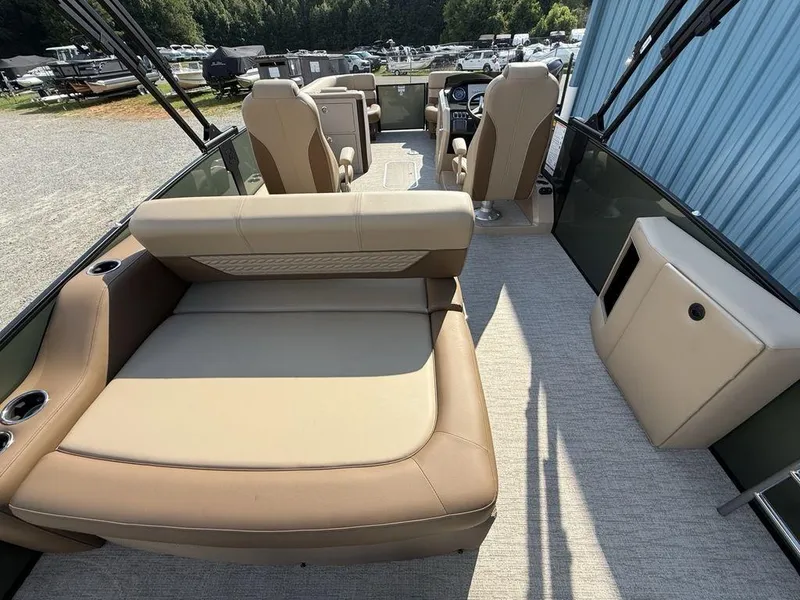 Slide: The Image of 2025 Godfrey Monaco 235 SFL iMPACT boat interior with beige seating and modern design. - 32