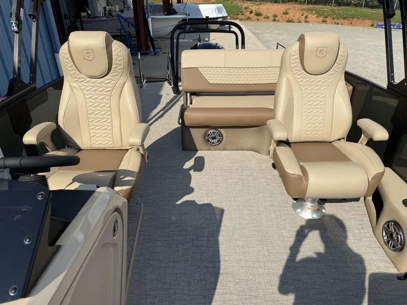 Slide: The Image of Luxurious seating on 2025 Godfrey Monaco 235 SFL iMPACT pontoon boat, featuring beige upholstery. - 8