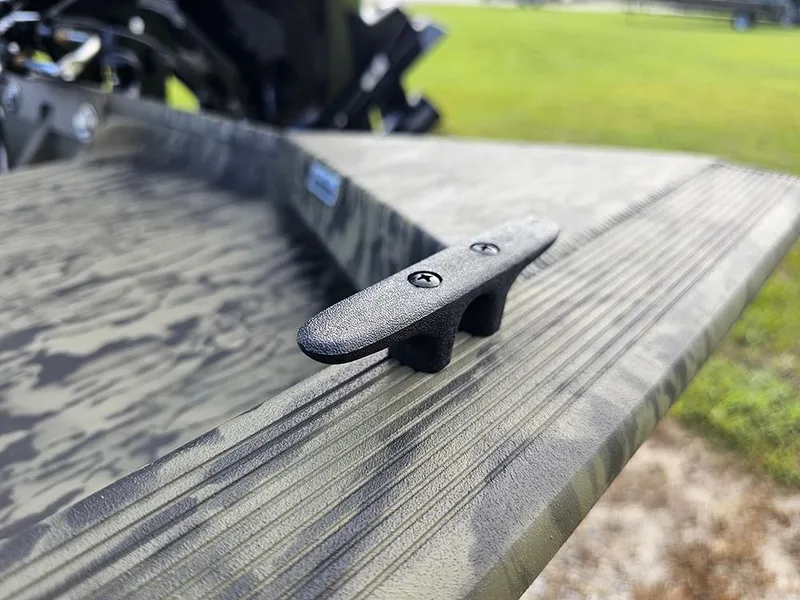 Slide: The Image of Close-up of 2026 Tracker Grizzly 1860 CC boat cleat on textured surface. - 15