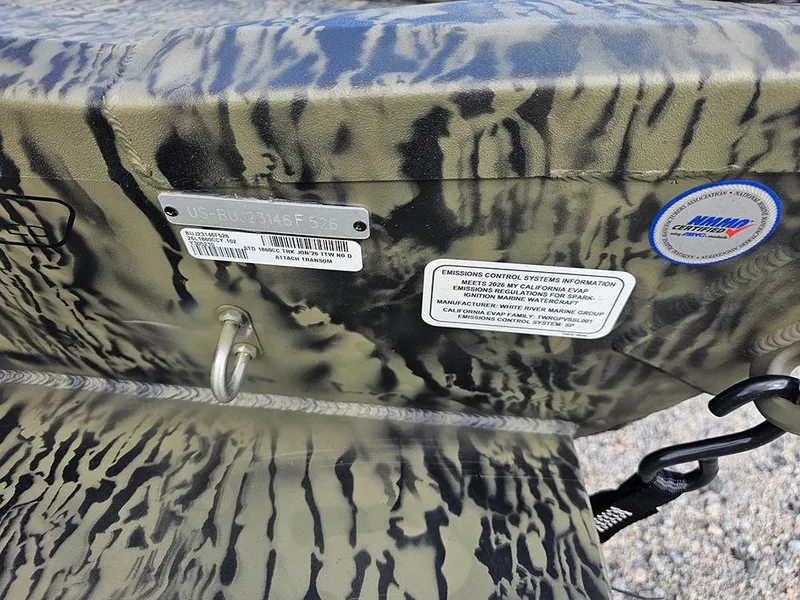 Slide: The Image of 2026 Tracker Grizzly 1860 CC boat with camouflage pattern and certification labels. - 17