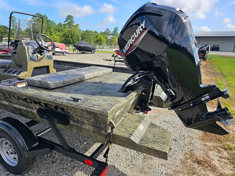 Slide: The Image of 2026 Tracker Grizzly 1860 CC boat with Mercury outboard motor on trailer. - 9