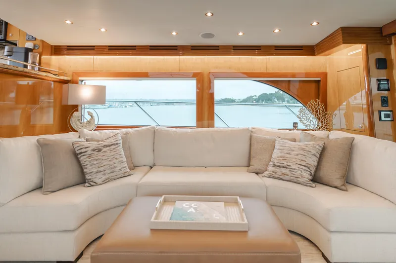 Slide: The Image of Luxurious interior of 2007 Hatteras 64 Motor Yacht with elegant seating and large windows. - 10