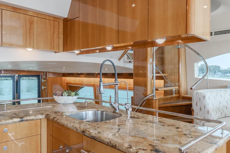 Slide: The Image of Luxurious kitchen interior of 2007 Hatteras 64 Motor Yacht with granite countertops and modern fixtures. - 12