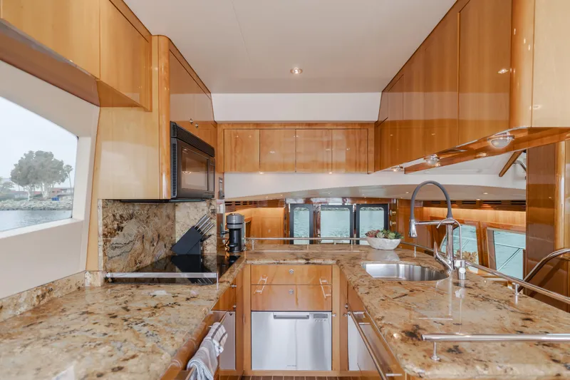 Slide: The Image of Luxurious kitchen interior of 2007 Hatteras 64 Motor Yacht with granite countertops. - 13