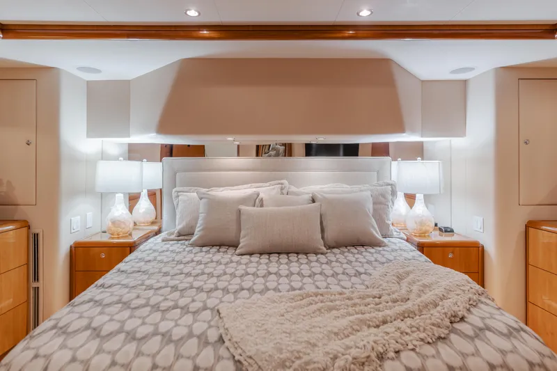 Slide: The Image of Luxurious bedroom interior of 2007 Hatteras 64 Motor Yacht with elegant bedding and lighting. - 16