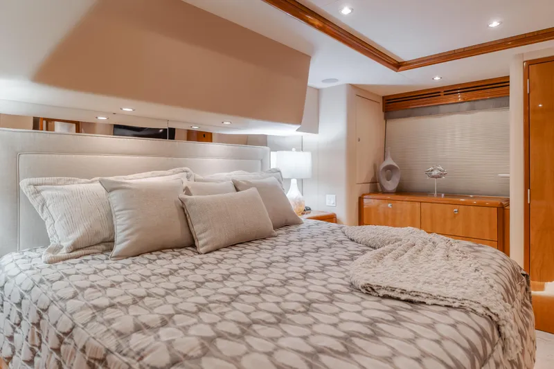 Slide: The Image of Luxurious bedroom interior of 2007 Hatteras 64 Motor Yacht with elegant bedding and decor. - 17