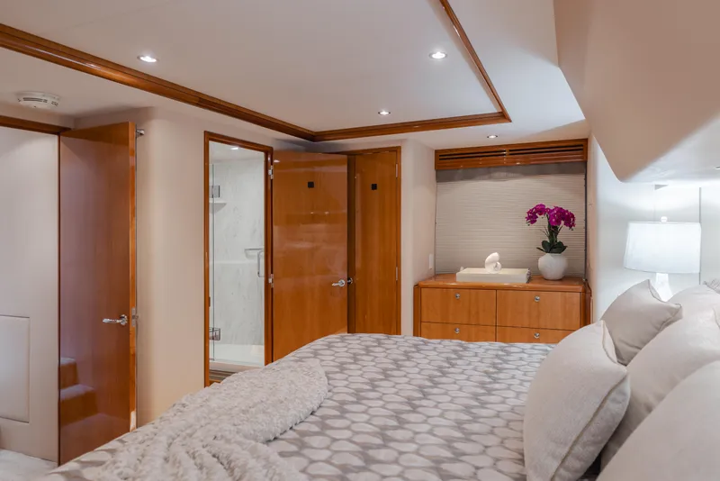 Slide: The Image of Luxurious bedroom interior of 2007 Hatteras 64 Motor Yacht with elegant decor and modern amenities. - 19