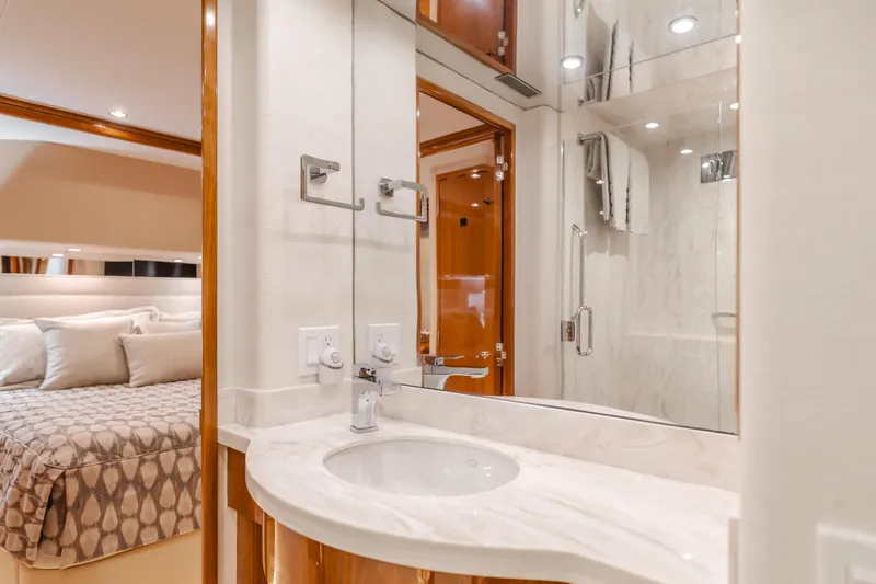 Slide: The Image of Luxurious bathroom in 2007 Hatteras 64 Motor Yacht with marble sink and modern fixtures. - 20