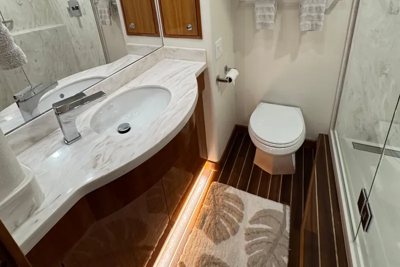 Slide: The Image of Luxurious bathroom in 2007 Hatteras 64 Motor Yacht with modern fixtures and elegant design. - 21