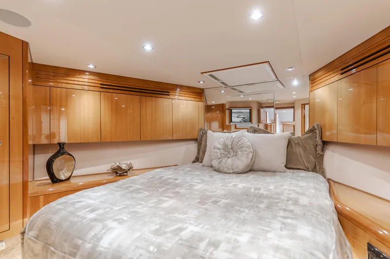 Slide: The Image of Luxurious bedroom interior of 2007 Hatteras 64 Motor Yacht with elegant wood finishes. - 25
