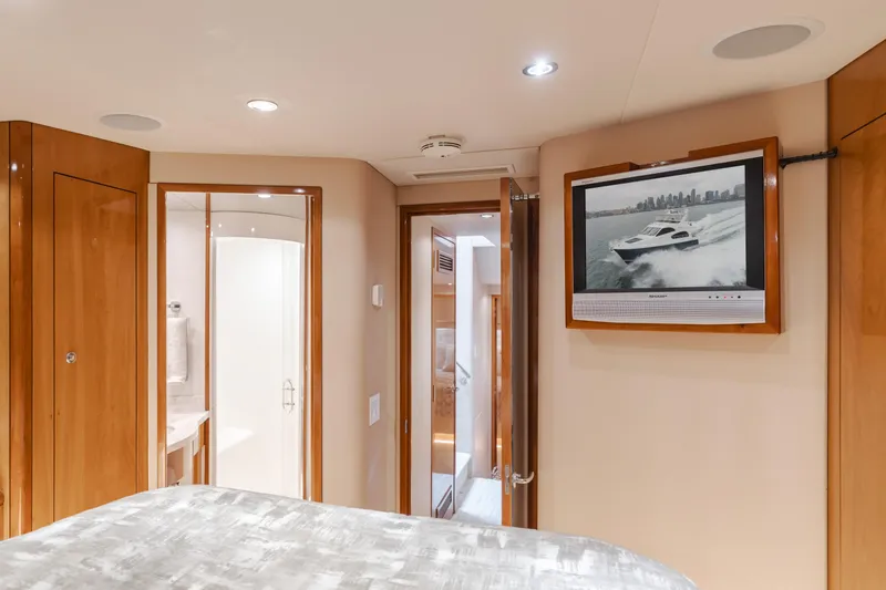 Slide: The Image of Interior of 2007 Hatteras 64 Motor Yacht with TV and bathroom view. - 26