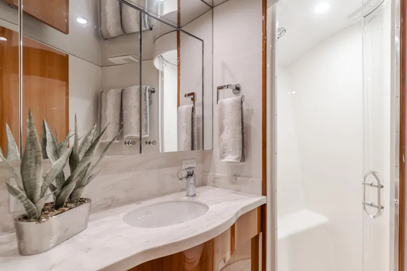 Slide: The Image of Luxurious bathroom in 2007 Hatteras 64 Motor Yacht with elegant fixtures and modern design. - 27