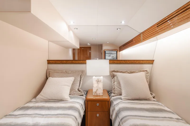 Slide: The Image of Luxurious twin bedroom in 2007 Hatteras 64 Motor Yacht with elegant decor and soft lighting. - 28