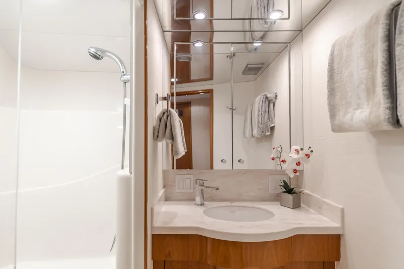 Slide: The Image of Luxurious bathroom in 2007 Hatteras 64 Motor Yacht with modern fixtures and elegant decor. - 30