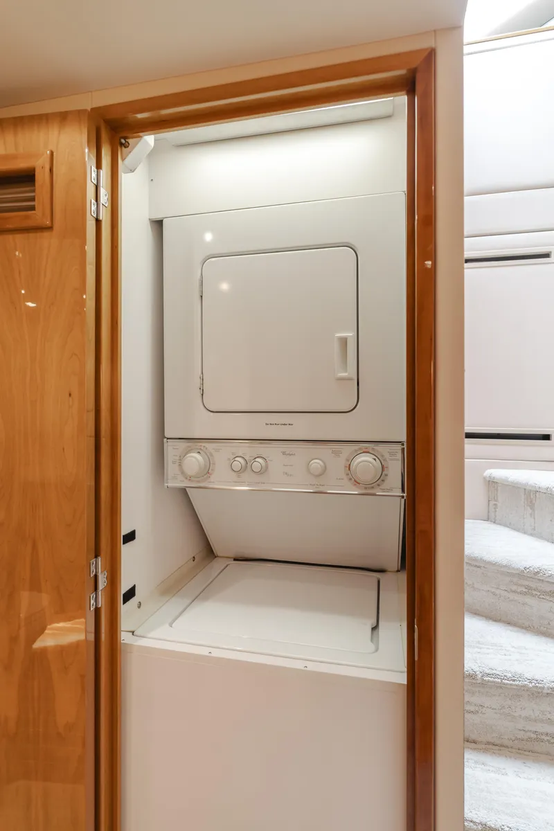 Slide: The Image of Stacked washer and dryer in 2007 Hatteras 64 Motor Yacht laundry area. - 31