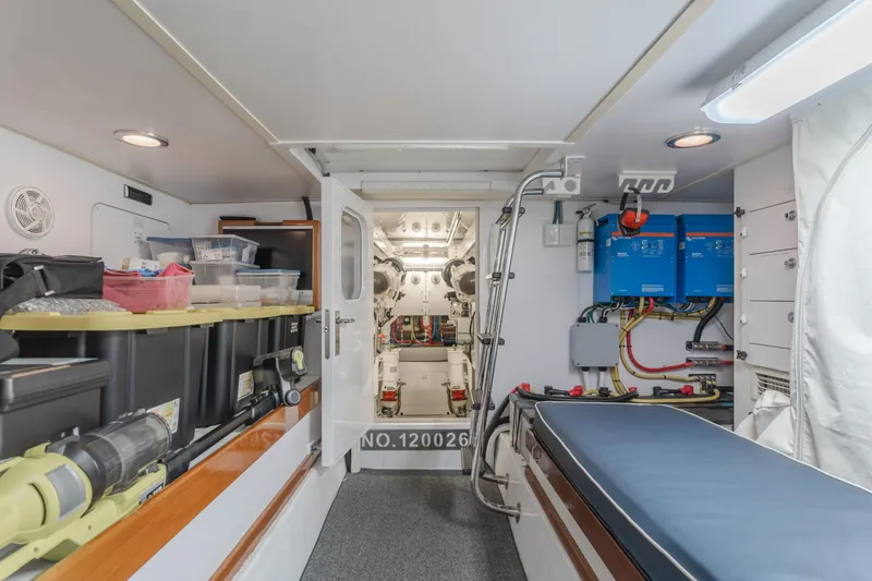 Slide: The Image of Engine room of 2007 Hatteras 64 Motor Yacht with organized storage and equipment. - 42