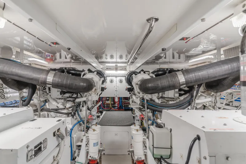 Slide: The Image of Engine room of 2007 Hatteras 64 Motor Yacht, showcasing mechanical components and systems. - 46