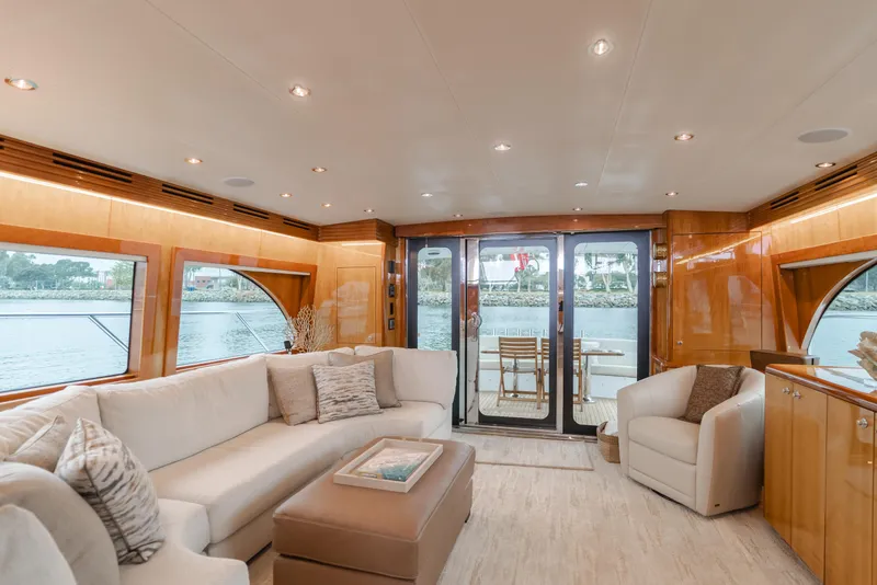 Slide: The Image of Luxurious interior of 2007 Hatteras 64 Motor Yacht with elegant seating and large windows. - 8