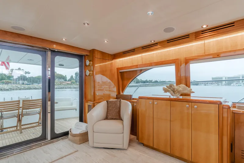 Slide: The Image of Luxurious interior of 2007 Hatteras 64 Motor Yacht with elegant seating and scenic views. - 9