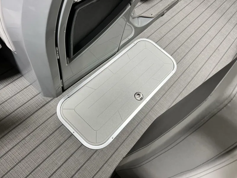 Slide: The Image of Floor hatch on 2025 Godfrey AquaPatio 235 SFLC iMPACT boat, featuring sleek gray design. - 11