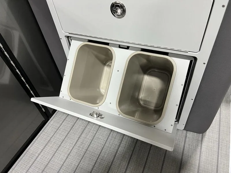 Slide: The Image of Storage compartment with dual bins in 2025 Godfrey AquaPatio 235 SFLC iMPACT boat. - 12