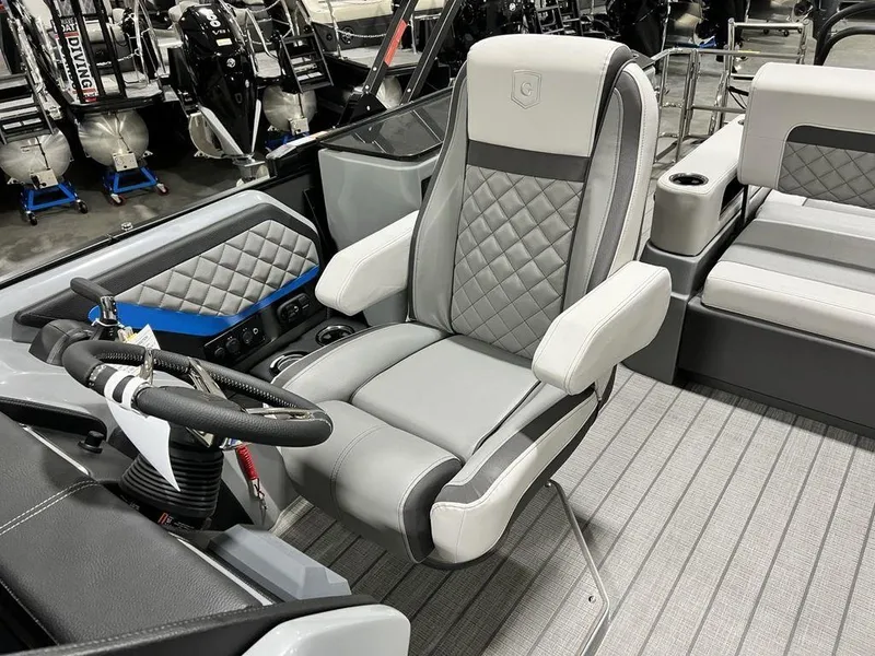 Slide: The Image of Luxury seating on 2025 Godfrey AquaPatio 235 SFLC boat, featuring quilted upholstery and modern design. - 15