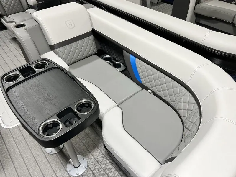 Slide: The Image of Luxurious seating on 2025 Godfrey AquaPatio 235 SFLC with quilted upholstery and integrated cup holders. - 2