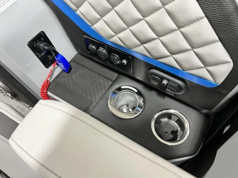 Slide: The Image of Interior of 2025 Godfrey AquaPatio 235 SFLC with cup holders and control panel. - 23