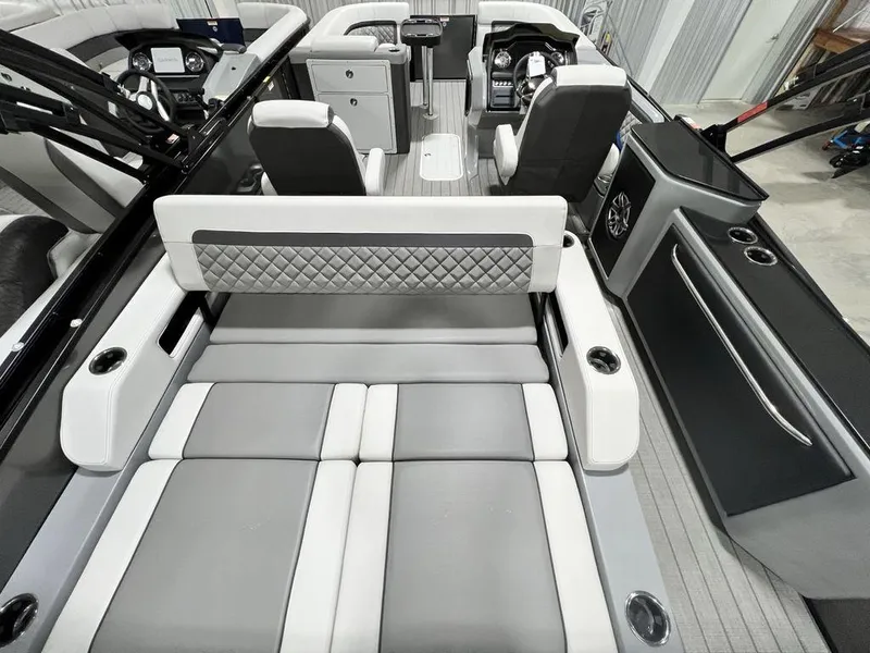 Slide: The Image of Luxurious interior of 2025 Godfrey AquaPatio 235 SFLC pontoon boat with modern seating and controls. - 30
