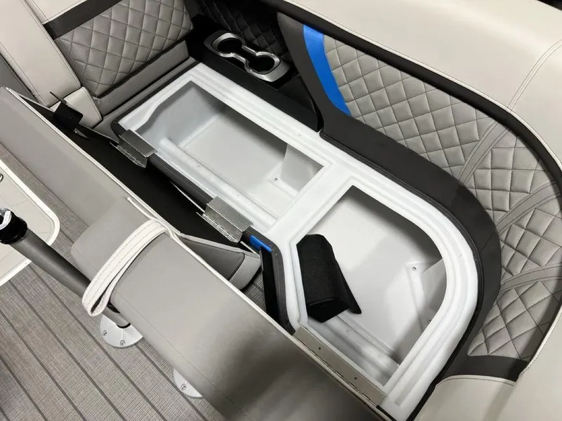 Slide: The Image of 2025 Godfrey AquaPatio 235 SFLC boat interior storage compartment with quilted seating. - 6