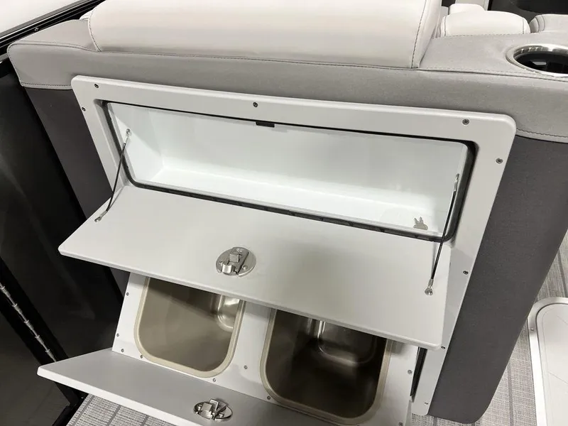 Slide: The Image of 2025 Godfrey AquaPatio 235 SFLC storage compartment with dual stainless steel sinks. - 9