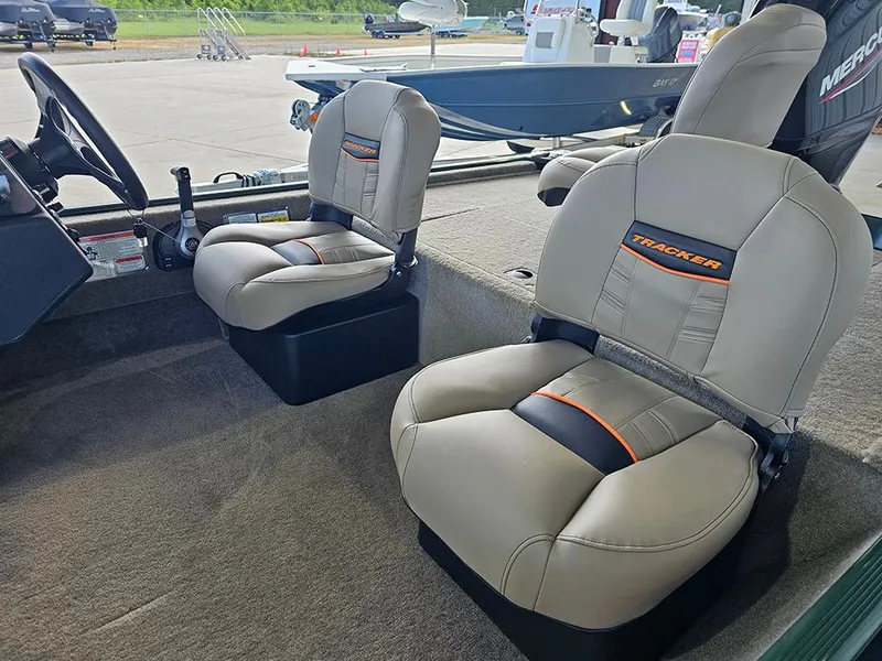 Slide: The Image of 2026 Tracker Bass Tracker Classic Limited boat interior with comfortable seating and steering wheel. - 11