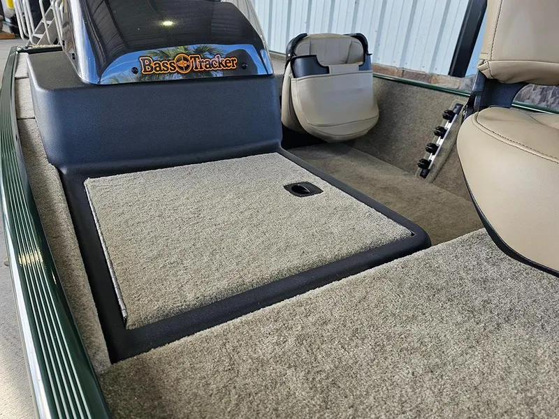 Slide: The Image of 2026 Tracker Bass Tracker Classic Limited boat interior with carpeted deck and seating. - 15