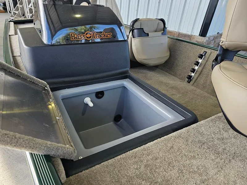 Slide: The Image of 2026 Tracker Bass Tracker Classic Limited boat interior with open storage compartment. - 16