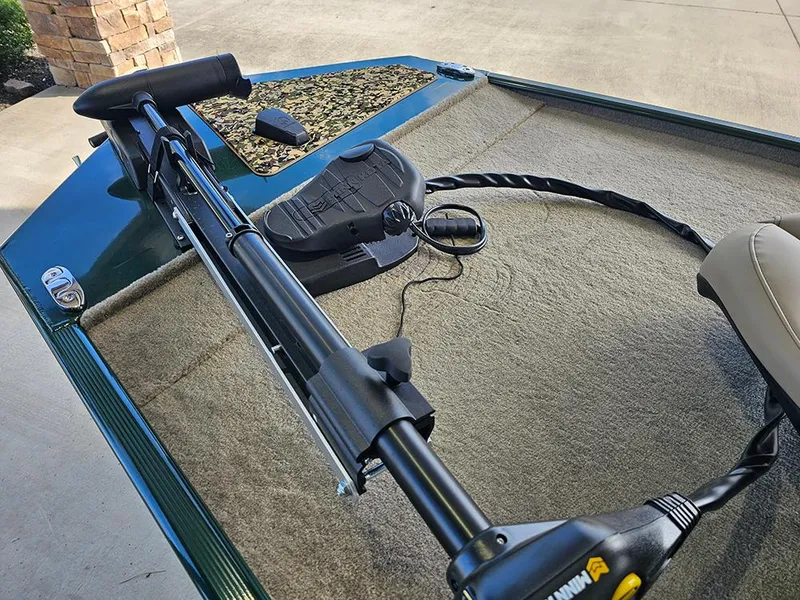 Slide: The Image of 2026 Tracker Bass Tracker Classic Limited boat with trolling motor and foot pedal on deck. - 18