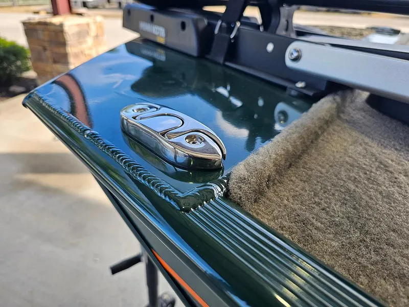 Slide: The Image of 2026 Tracker Bass Tracker Classic Limited boat detail with chrome cleat and carpeted edge. - 20