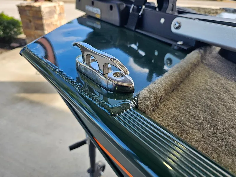 Slide: The Image of Close-up of 2026 Tracker Bass Tracker Classic Limited boat cleat and carpeted edge. - 21