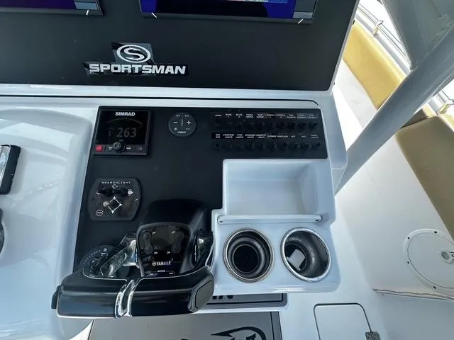 Slide: The Image of Control panel of 2018 Sportsman Open 252 Center Console boat with navigation equipment. - 19