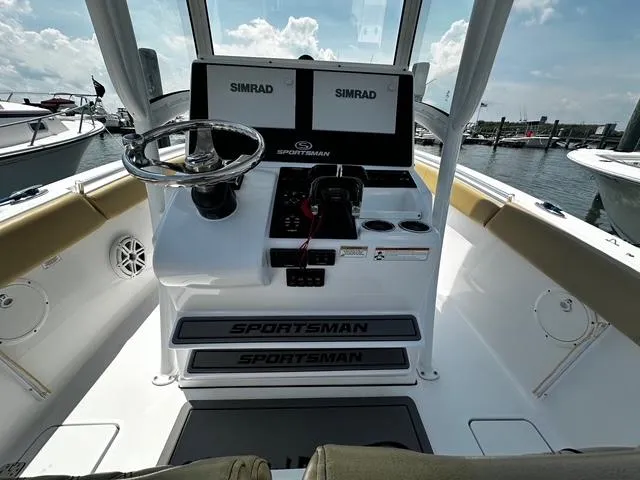 Slide: The Image of 2018 Sportsman Open 252 Center Console boat dashboard with dual Simrad displays. - 22