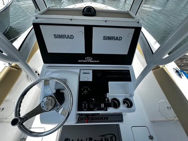 Slide: The Image of 2018 Sportsman Open 252 Center Console with dual Simrad displays and steering wheel. - 26